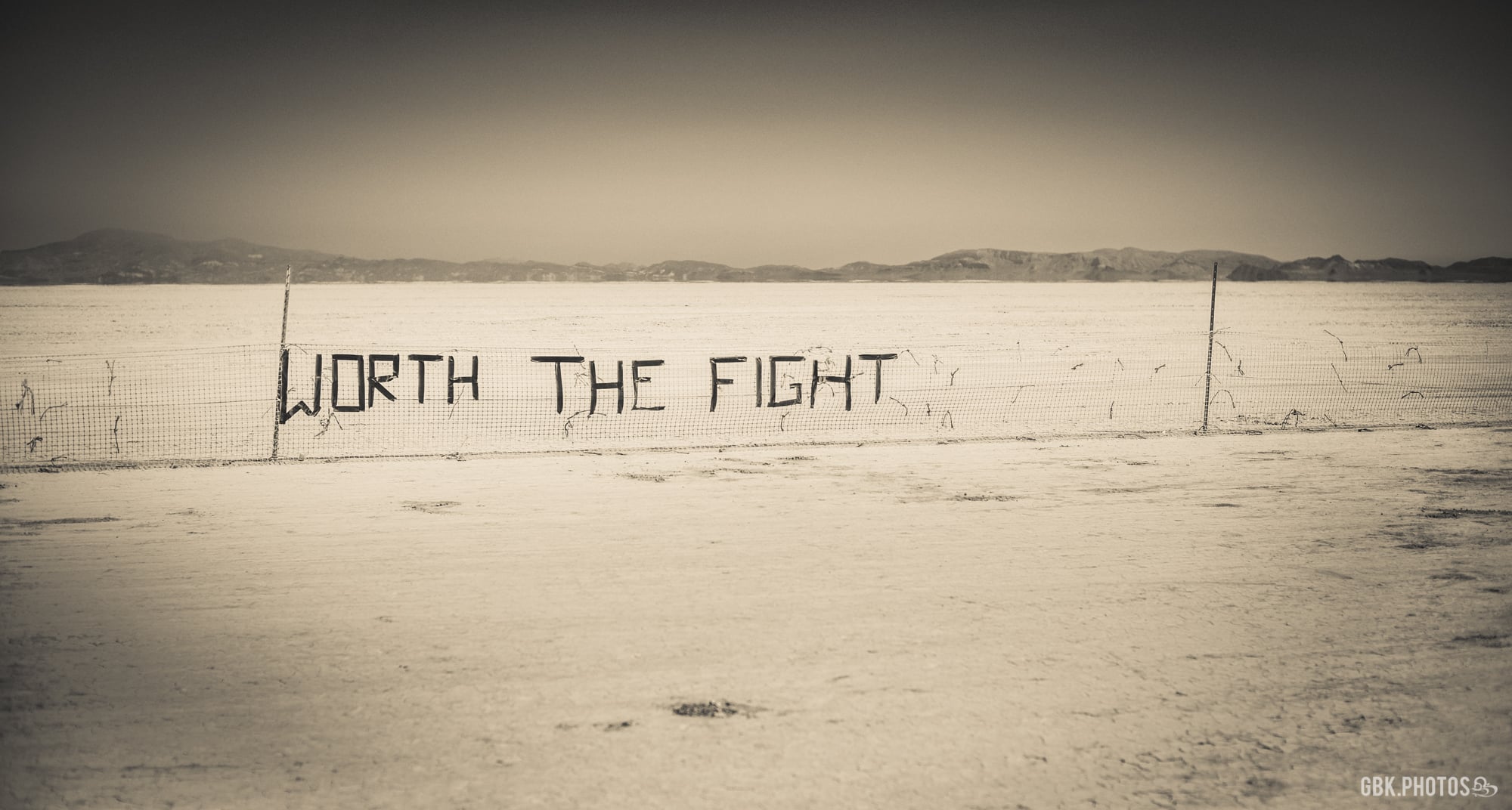 worth the fight burning man trash fence 2012