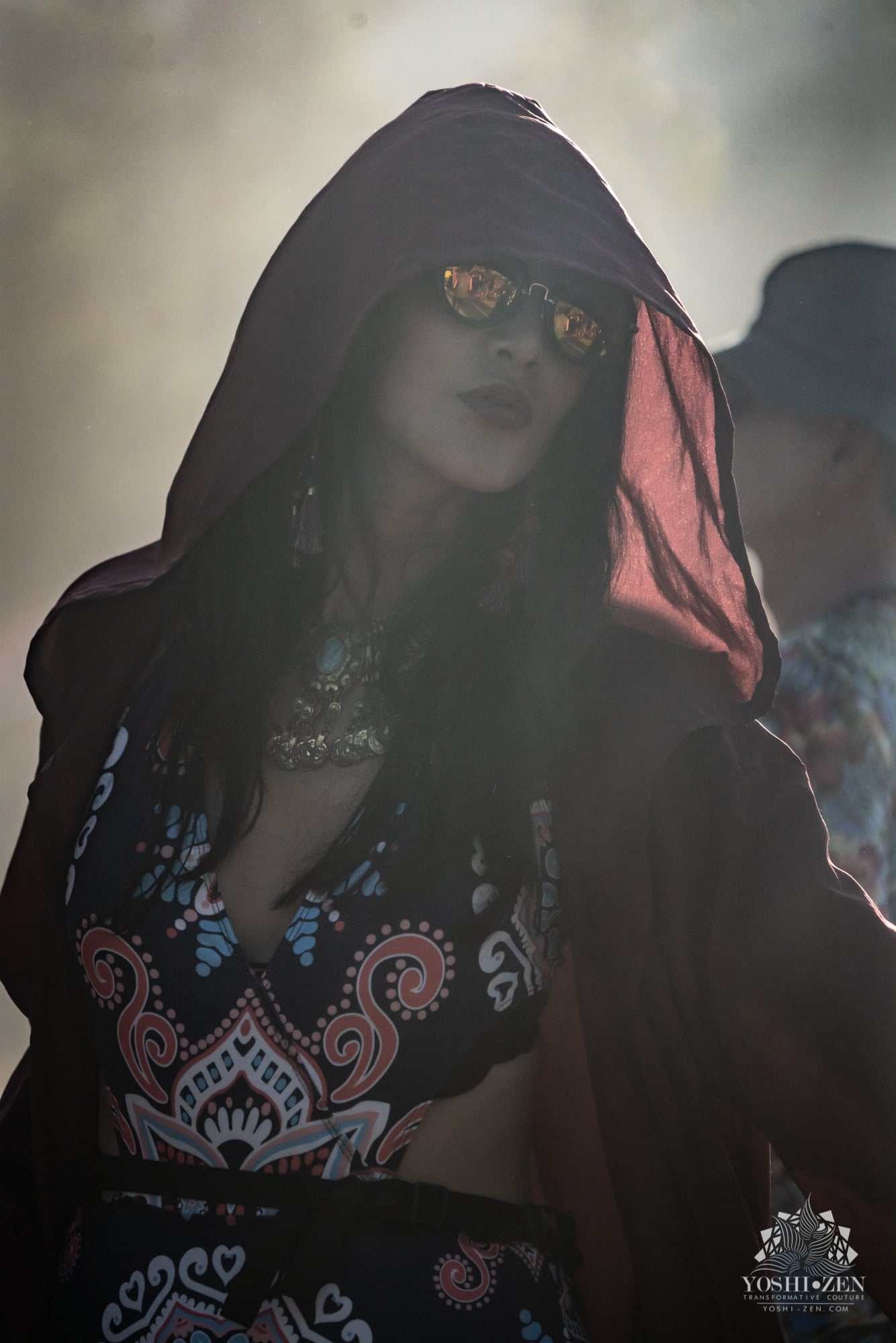 Festival-goers in vibrant costumes at night