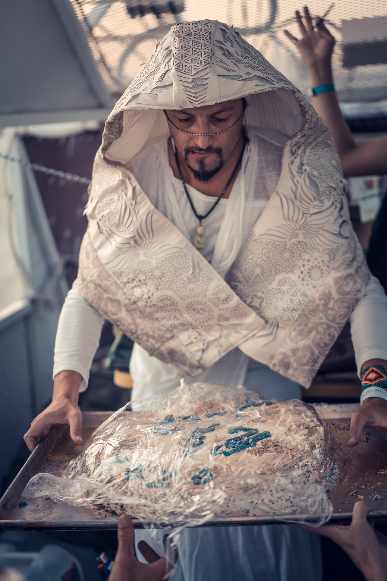 Gilles trying not to drop the cake