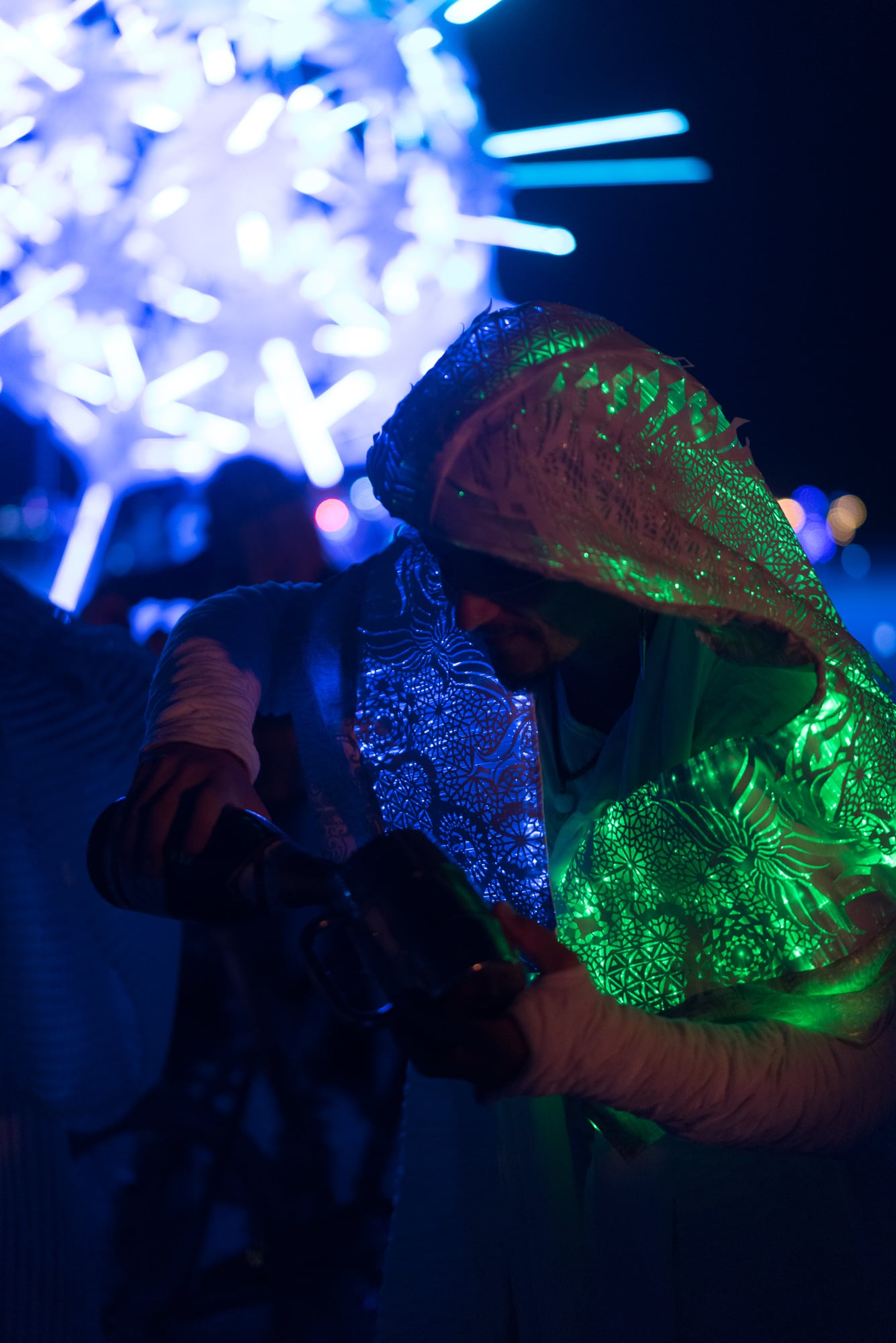 Intergalactic groom with fiber optic costume and champagne