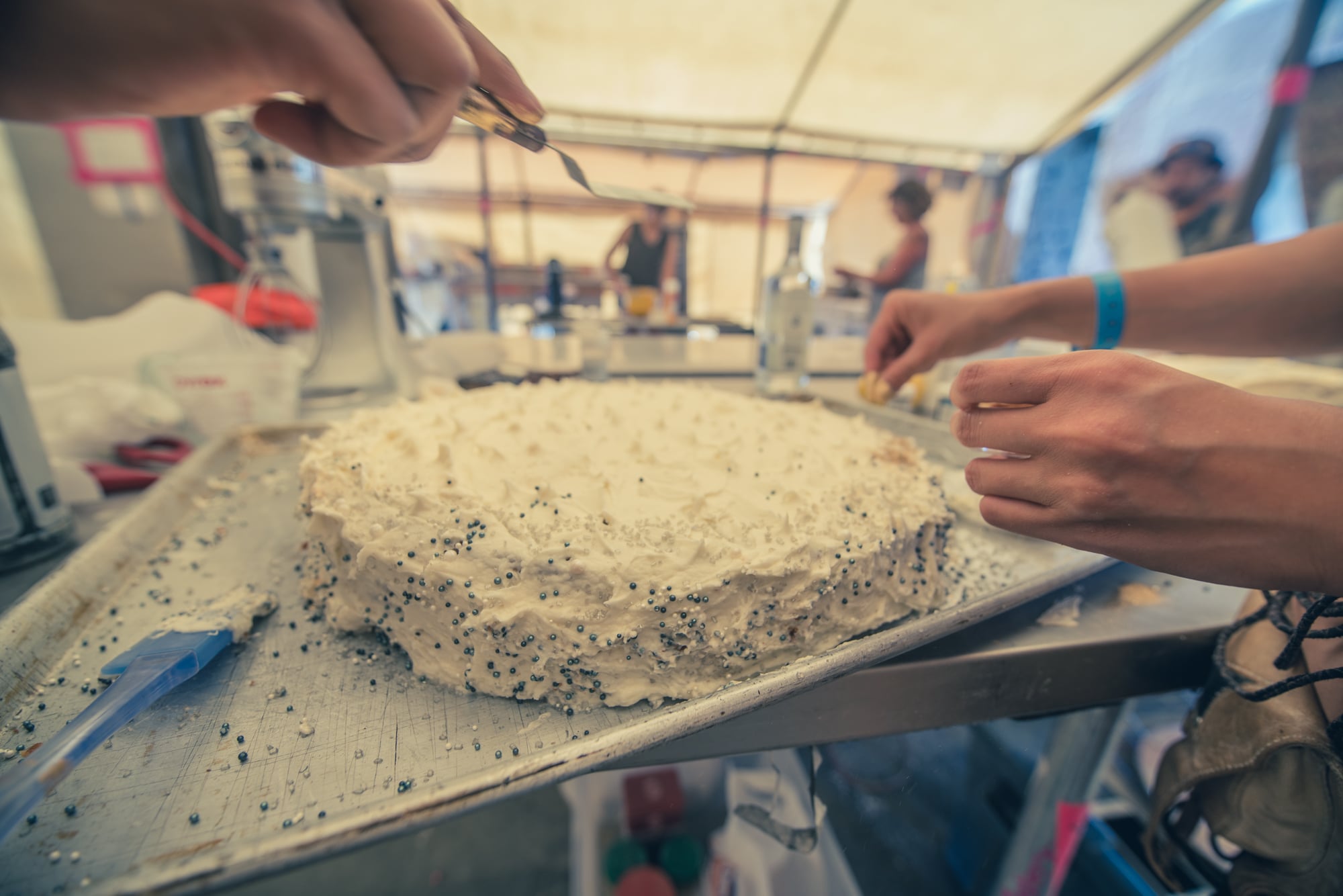Decorating the wedding cake at Black Rock City Bakery